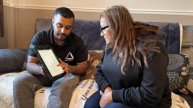Green Doctor Fayad and Neena looking at online information to save money.
