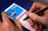 Filling out a lottery ticket.