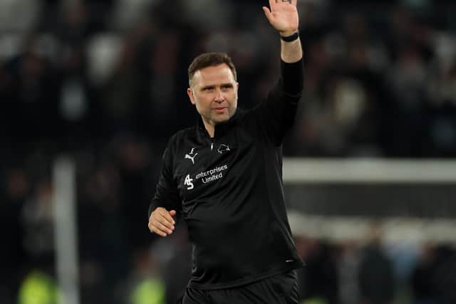 John Eustace, Head Coach of Derby County shows his appreciation to the fans following the Sky Bet Championship match between Derby County FC and Burnley FC at Pride Park on April 08, 2025 in Derby, England. (Photo by Morgan Harlow/Getty Images)