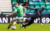 Hibs' Chris Cadden and St Johnstone's Adama Sidibeh tussle for possession at Easter Road.