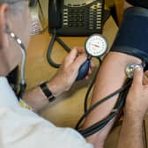 File photo dated 10/09/14 of a GP checking a patient's blood pressure, as GPs in England are to be given new powers to send their patients directly for checks for a range of respiratory and heart conditions, with up to one million people expected to benefit, NHS officials have announced.