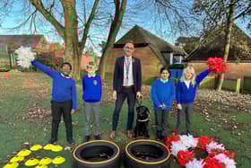 Mr Smith with Nelson the school dog and pupils at St Peter's CofE Junior School in Littleover
