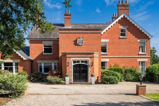 A coat of arms above the main entrance makes a grand statement.