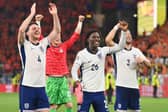 Declan Rice, Kobbie Mainoo and Luke Shaw celebrate after England beat the Netherlands during the UEFA EURO 2024 semi-final match.