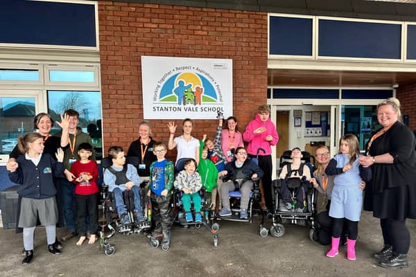 Image shows students from each of the different pathways with Emma Kehoe (far left, back row) and staff from the school.