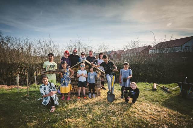 The residents at Boundary Moor Gardens posed with their new handmade insect hotel.