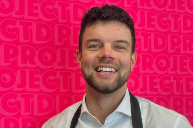 Project D's creative director Matt Bond with the 24 Karat Magic Love Heart Mega doughnut.