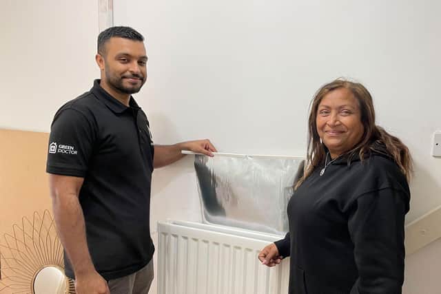 Green Doctor Fayad and Neena with one of the free radiator panels