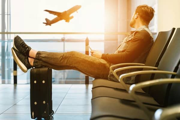 Passenger waits in the departure lounge of an airport