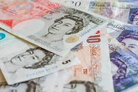 File photo of a pile of pound sterling notes