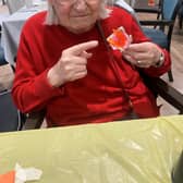 Resident with her flower