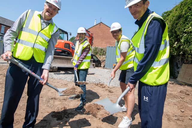 Andrew Redfern (left) breaking ground for new Framework accommodation