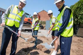 Andrew Redfern (left) breaking ground for new Framework accommodation