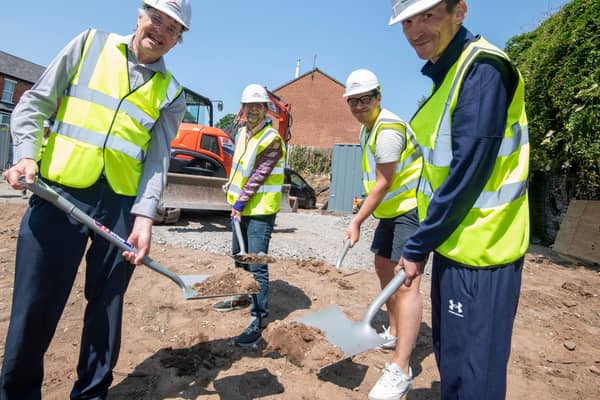 Andrew Redfern (left) breaking ground for new Framework accommodation