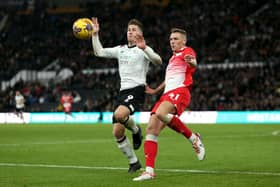 Derby County's James Collins (left) and Barnsley's Jack Shepherd battle for the ball during the Sky Bet League One match in November. Shepherd moved on loan to Cheltenham Town at the end of the winter window. Picture: Barrington Coombs/PA Wire.