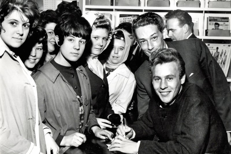 PYE recording artist Mark Wynter signs autographs at a music shop in Heanor, 1962.