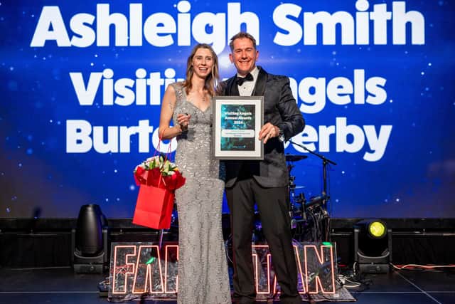 Ashleigh receiving her award from Dan Archer, UK CEO of Visiting Angels